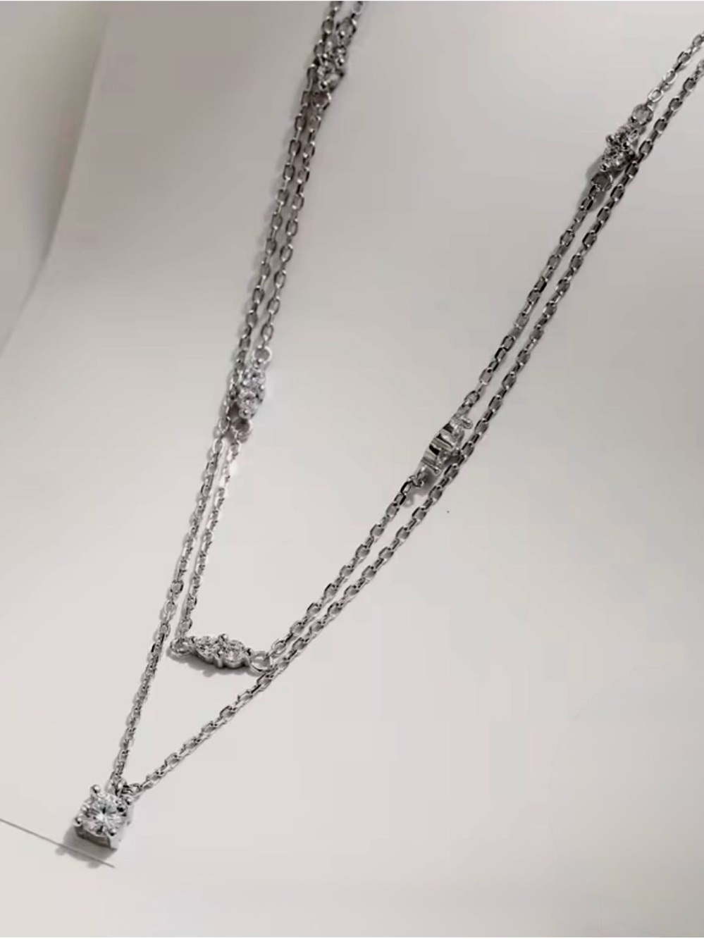 Layered Silver Necklace with Sparkling White Crystal Pendant